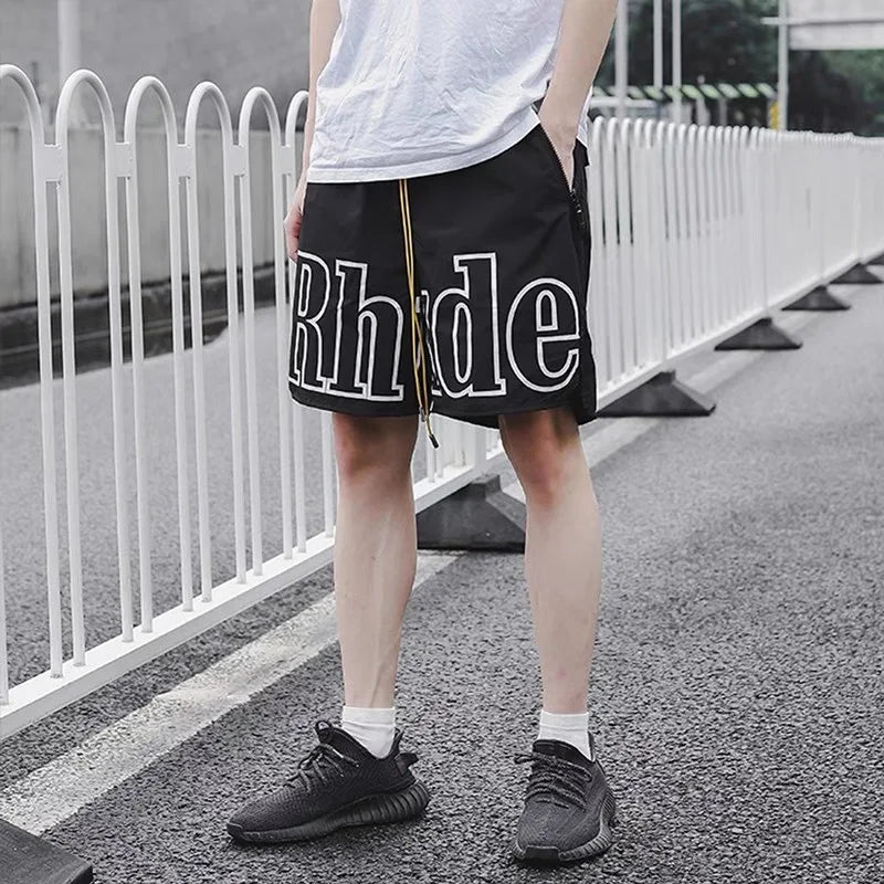 2026 Rhude High Street Trend Casual Shorts Men Woman Letter Print Loose Breathable Light Quick Drying Rhude Sports Shorts